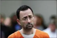  ?? PAUL SANCYA — THE ASSOCIATED PRESS ?? In this Nov. 22, 2017, file photo, Dr. Larry Nassar appears in court for a plea hearing in Lansing, Mich. Michigan State University has reached a $500 million settlement with hundreds of women and girls who say they were sexually assaulted by Nassar in...