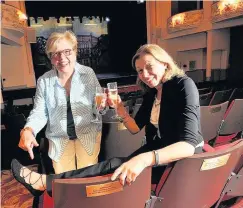  ??  ?? Seats of love Sisters Margaret Rodriquez and Joyce Gifford toast their folks and their side- by- side seats 310517feet_ 01