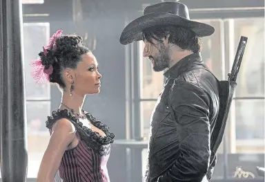  ??  ?? ▼ Thandie Newton with Rodrigo Santoro in Westworld, above, and left with her Emmy.