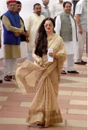  ?? — PTI ?? Rajya Sabha MPs Rekha (clockwise from above), Sachin Tendulkar, Farooq Abdullah and Dimple Yadav after casting their votes for the vice-presidenti­al election in New Delhi on Saturday.