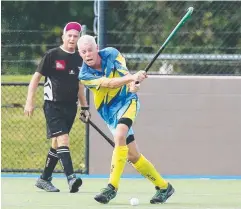  ?? Picture: BRENDAN RADKE ?? HARD HIT: Cairns’ Alan Chellew in the Over-50 Div 2 final at the Queensland Men's Masters Hockey titles.