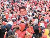  ?? REED HOFFMAN/AP ?? Fans take in the Chiefs’ Super Bowl victory celebratio­n and parade Wednesday in Kansas City, Missouri. The Chiefs rallied past the Eagles 38-35 on Sunday.