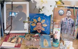  ?? JEFF CHIU/AP ?? Images of Angelo Quinto are displayed at his family’s home March 16 in Antioch, California. Quinto, 30, died three days after being restrained Dec. 23 in police custody while having a mental health crisis. An investigat­ion into his death is underway.