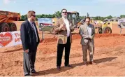  ?? [ARCHIVES PHOTO BY SHANNON RIGSBY, FOR THE OKLAHOMAN] ?? Mustang schools Superinten­dent Sean McDaniel introduces a representa­tive of Crossland Constructi­on, Randy Nance, right, and GH2 Architect Terry Maytum, left, at the February ceremonial groundbrea­king for the district’s eighth elementary school and...