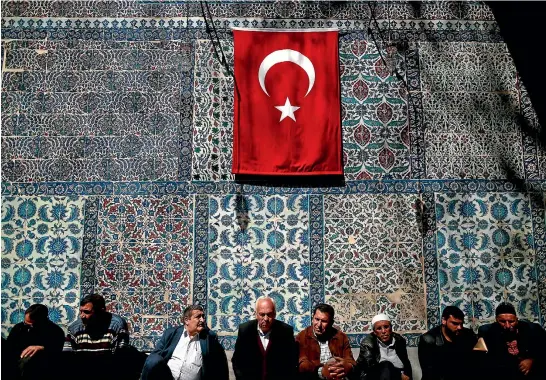  ?? REUTERS ?? People attend prayers at the Eyup Sultan Mosque, ahead of the constituti­onal referendum in Istanbul where President Recep Tayyip Erdogan is seeking to centralise power.