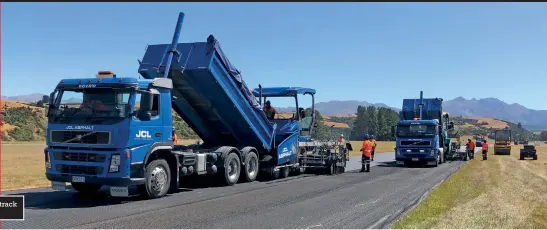  ??  ?? Workers laying the new track surface earlier this year.