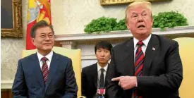  ?? —REUTERS ?? PRESUMMIT HOOPLA US President Donald Trump gestures as he and South Korean President Moon Jae-in briefs journalist­s at the White House.