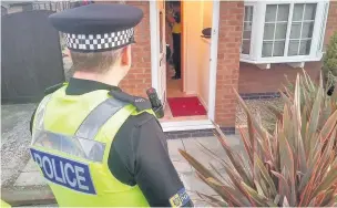  ??  ?? ●● Police raid a home as part of Operation Alzira