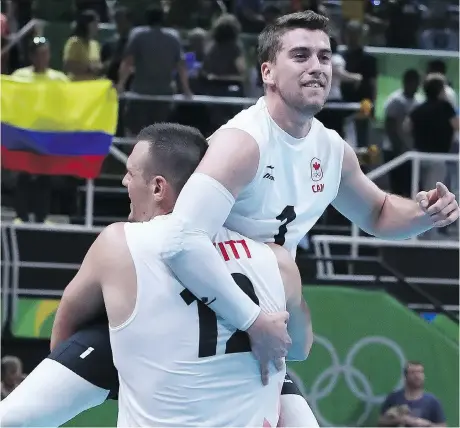  ?? GETTY IMAGES ?? Canadian volleyball captain Tyler Sanders is hoisted by teammate Gavin Schmitt after their surprising three-game sweep of the heavily favoured Americans at the Rio Summer Olympics in August 2016. Both players will be in action when the two teams meet...