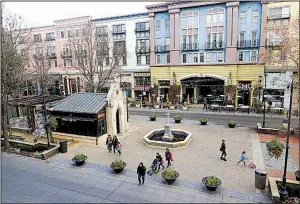  ?? Bay Area News Group/JIM GENSHEIMER ?? Shoppers visit the open square and shops at Santana Row earlier this month in San Jose, Calif. Santana Row is known for its high-end shops with luxury condominiu­ms and apartments above.