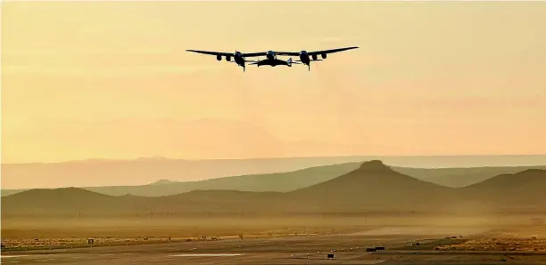  ??  ?? A jet carrying Virgin Galactic’s tourism spaceship takes off from Mojave Air and Space Port yesterday in Mojave, California. The jet climbed to an altitude near 13 kilometres and then released Virgin Space Ship Unity.