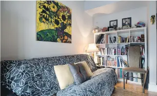  ??  ?? Ghislaine Laforest runs her travel business from a comfortabl­e home office, which features a striking painting of sunflowers.