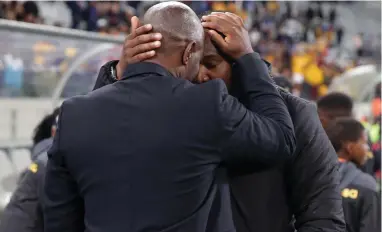  ??  ?? RESPECT: Steve Komphela and Benni McCarthy share a moment at Cape Town Stadium on Wednesday.