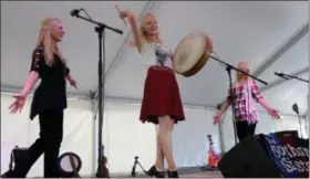  ?? NEWS-HERALD FILE ?? Celtic-inspired folk trio The Gothard Sisters, who are sisters by genetics as well as by moniker, wrap up a number on the Ohio Savings Bank Stage Aug. 12 during opening day of the 2016 Ohio Celtic Festival at Classic Park in Eastlake.