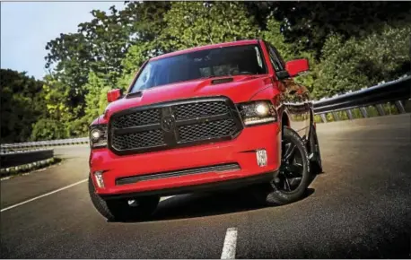  ?? MOTORMATTE­RS ?? The Ram 1500 Night starts with key Sport appearance cues, including body-color fascia and body-color rear bumper with dual chrome exhaust tips, body-color power-folding mirrors and door handles.