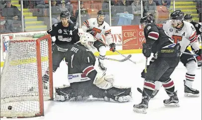  ?? TRURO DAILY NEWS PHOTO ?? Brandon Hughes and Denver Lynds watch as Lynds’s first of two goals finds the back of the net in the second period to put the Bearcats up 4- 1. The pair combined for seven points, including five of Truro’s six goals.