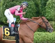  ?? JANET GARAGUSO/NYRA ?? Jockey Ricardo Santana Jr. celebrates aboard filly Got Stormy who became the first female horse to win The Fourstarda­ve (GI) at Saratoga Race Course Saturday afternoon.