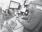  ?? USA TODAY NETWORK ?? Jason Hamholm repairs a relay tester at Electronic Specialtie­s in Genoa City, hit by a 25 percent tariff on Chinese products.