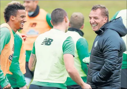  ?? Picture: SNS ?? O CAPTAIN MY CAPTAIN: Brendan Rodgers (right) reckons Scott Brown (centre) could have prospered in England.