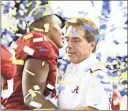  ?? Kevin C. Cox/Getty Images North America/TNS ?? Head coach Nick Saban of the Alabama Crimson Tide celebrates with his players after their 32-13 win against the Florida Gators during the SEC Championsh­ip game at the Georgia Dome on Dec. 5, 2009 in Atlanta, Georgia.