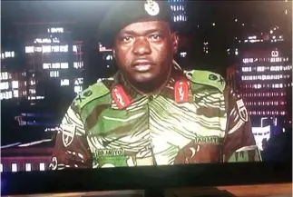  ??  ?? This TV screen grab on Wednesday shows Maj. Gen. Sibusiso Moyo reading a statement at the Zimbabwe Broadcasti­ng Corporatio­n (ZBC) in Harare. (AFP)