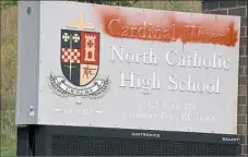  ?? Darrell Sapp/Post-Gazette ?? Someone spray-painted over the name of Cardinal Wuerl on the high school sign at the school’s entrance in Cranberry. The vandalism was reported around 7 a.m. Monday.