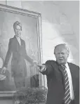  ?? AUDE GUERRUCCI, POOL PHOTO ?? President Trump and a portrait of Hillary Clinton.