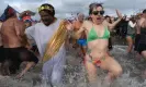  ?? Photograph: Stephanie Keith/Getty Images ?? People run into the ocean during the annual Coney Island Polar Bear Club swim, on 1 January 2016 in Brooklyn, New York City.