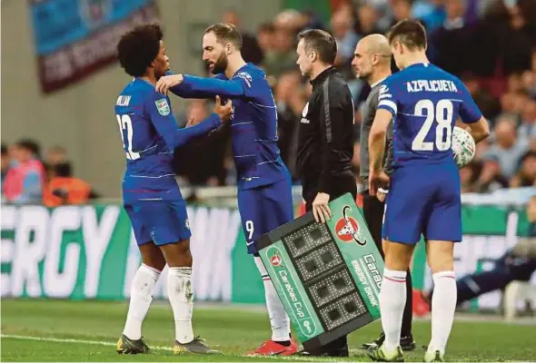  ?? REUTERS PIC ?? Chelsea have the option to sign Gonzalo Higuain (second from left) for RM171 million or can extend his loan for another 12 months for RM87 million.