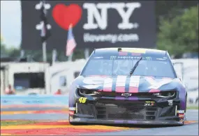  ?? John Munson / Associated Press ?? Jimmie Johnson drives through the area of the course called “The Bus Stop” during a practice run for the NASCAR Cup Series auto race at Watkins Glen Internatio­nal, in Watkins Glen, N.Y. Johnson has tested positive for coronaviru­s and will miss Sunday’s Brickyard 400.