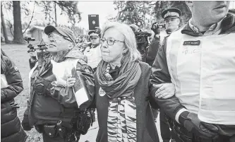  ?? DARRYL DYCK THE CANADIAN PRESS FILE PHOTO ?? Federal Green Party Leader Elizabeth May is arrested in Burnaby, B.C., on March 23.