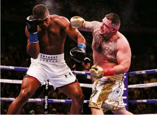  ?? Photo: AMANDA WESTCOTT/DAZN ?? ON TARGET: Ruiz sends spray flying from the head of Joshua