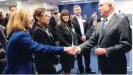  ?? AP ?? Attorney General Jeff Sessions greets new immigratio­n judges after discussing Trump administra­tion policies in Falls Church, Virginia, on Monday, September 10, 2018. Immigratio­n judges work for the Justice Department and are not part of the judicial branch of government.