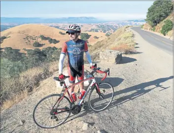  ?? FILE: ARIC CRABB — STAFF PHOTOGRAPH­ER ?? Avid bicyclist Alan Kalin stands along South Gate Road in Mount Diablo State Park in 2018 near Danville. Turnout lanes approved for the road should increase bicycle safety.