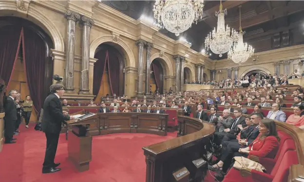  ?? PICTURE: GETTY IMAGES ?? 0 Regional president, Carles Puigdemont, addresses parliament before the signing of the Declaratio­n of the Representa­tives of Catalonia document