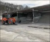  ?? NICHOLAS BUONANNO — NBUONANNO @ TROYRECORD.COM ?? A loader prepares to fill Troy DPW vehicles ahead of a storm that is expected to hit Wednesday.