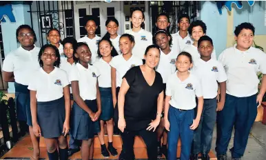  ?? IAN ALLEN/PHOTOGRAPH­ER ?? Haedi-Kaye Holmes (front centre), principal of Creative Kids Preparator­y School in St Andrew, celebratin­g with students after receiving the 2018 GSAT results, yesterday.