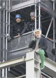  ??  ?? 0 Protester Ben Atkinson sits at the top of Big Ben while Steve Coogan joined the protest and Mr Broccoli was escorted away