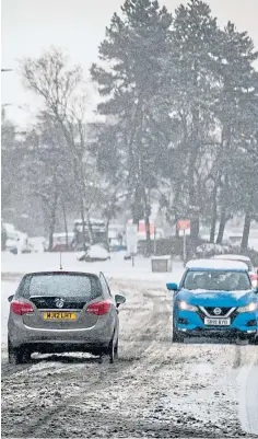  ??  ?? DRIVING SNOW: Storm Darcy took a heavy toll on motorists and residents.