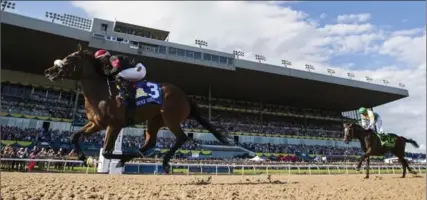  ?? MARK BLINCH, THE CANADIAN PRESS ?? Luis Contreras and Holy Helena win the 158th running of the Queen’s Plate at Woodbine in Toronto on Sunday.