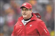  ?? Hannah Foslien / TNS ?? Head coach Paul Chryst of the Wisconsin Badgers looks on before the game against the Minnesota Golden Gophers at TCF Bank Stadium on Nov. 30 in Minneapoli­s. A COVID-19 outbreak that hit 12 people at Wisconsin, including 6 players and coach Chryst forced cancellati­on of Saturday’s game vs. Nebraska.