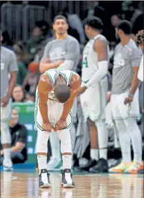  ?? STUART CAHILL / BOSTON HERALD FILE ?? A dejected Celtics guard Kemba Walker hangs his head in the final seconds as the Celtics take on the Jazz at the Garden on Friday, one of several tough losses suffered recently by the Celtics.