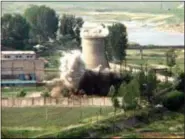  ?? AP PHOTO/APTN, FILE ?? FILE- In this June 27, 2008 file image from TV, the demolition of the 60-foot-tall cooling tower at its main reactor complex in Yongbyon North Korea. North Korea’s Foreign Ministry said Saturday May 12, 2018, it will hold a “ceremony” for the...