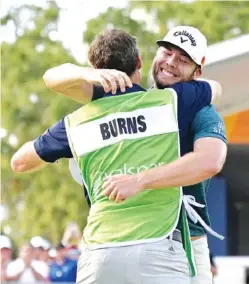  ?? AP PHOTO BY PHELAN M. EBENHACK ?? Sam Burns, right, is congratula­ted by his caddie after closing out his first PGA Tour victory at the Valspar Championsh­ip on Sunday in Palm Harbor, Fla.