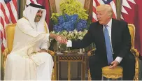  ?? STEPHEN CROWLEY/THE NEW YORK TIMES ?? President Donald Trump meets with Qatari Emir Tamim bin Hamad Al Thani last month in Riyadh, Saudi Arabia. Trump thrust himself into a dispute Tuesday by claiming credit for Saudi Arabia’s move to isolate Qatar, which is a major American military...