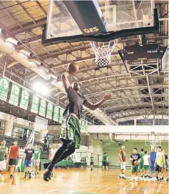  ??  ?? This picture taken on Jan 24 shows Cameroon’s Benoit Mbala attempting to dunk the ball during a practice session at De La Salle University’s gym in Manila. —AFP photo