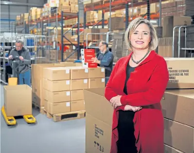  ??  ?? Above:Amanda Robertson, managing director – aftermarke­t for Stoneridge Electronic­s, in the warehouse of the group’s Dundee facility from where products are shipped across the world. Left: Stoneridge holds regular events to bring clients up to speed...