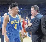  ?? MICHAEL OWEN BAKER/ASSOCIATED PRESS ?? UCLA coach Steve Alford, shown celebratin­g with guard Jaylen Hands, says he’s not feeling added pressure after his team was knocked out early in the NCAA Tournament last month.