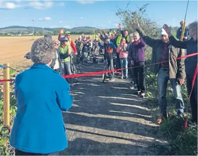  ??  ?? Locals gather to mark the opening of Mahri’s Walk, which runs from Errol Station to Inchmichae­l.