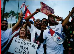  ?? Photo: Nampa/AFP ?? March… A woman holds a placard reading Freedom for Cuba as others demonstrat­e holding Cuban and US flags during a protest against the Cuban government in Miami on 11 July 2021. Thousands of Cubans across the country took part in rare protests against the government,marchingth­rough several towns chanting, “Down with the dictatorsh­ip” and “We want liberty.”